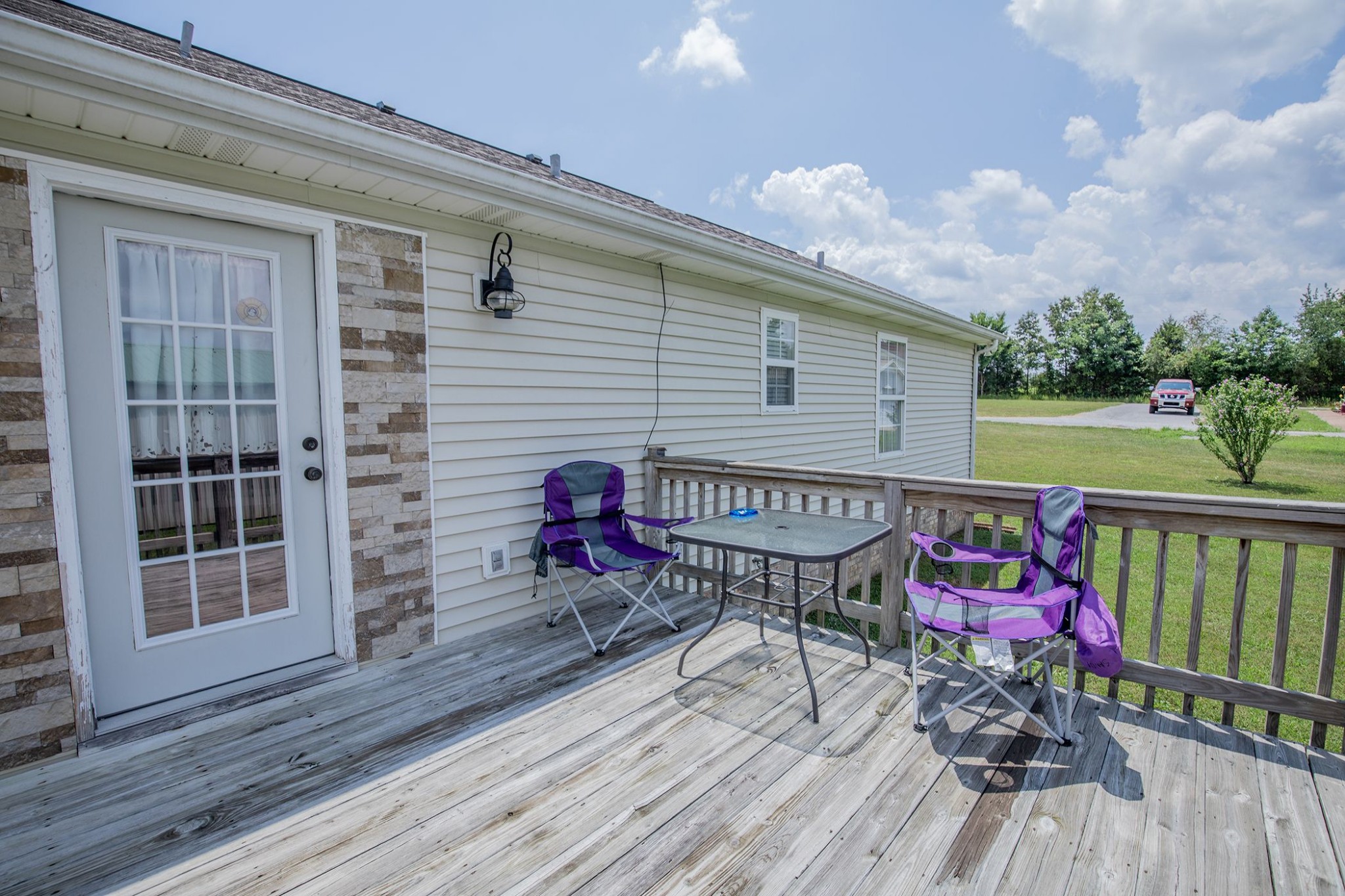 207 Hester Road Portland, TN 37148 - Photo 8 of 41 a view of a deck with wooden floor and outdoor seating