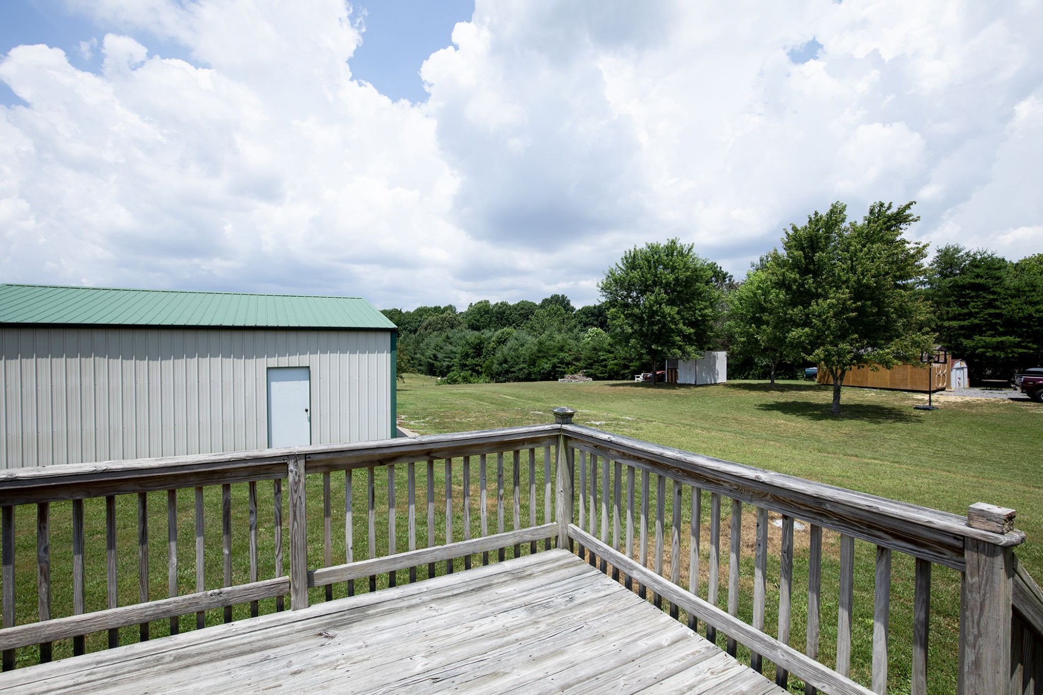 207 Hester Road Portland, TN 37148 - Photo 10 of 41 a balcony with trees in front of it