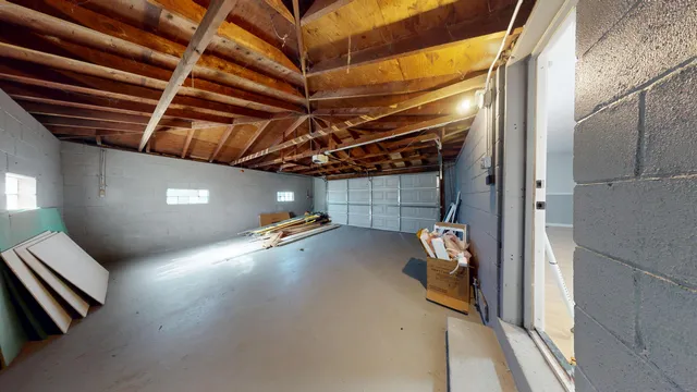 a view of storage and utility room with stairs