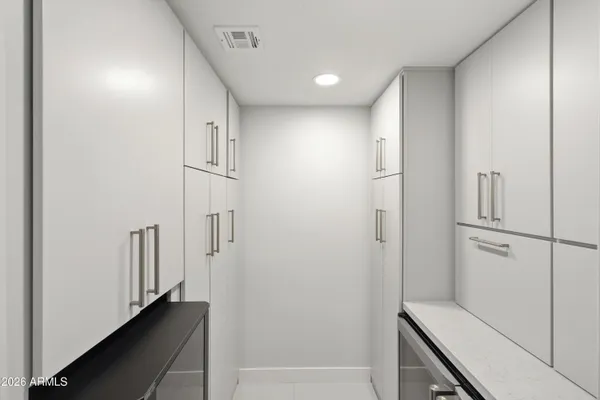a kitchen with stainless steel appliances granite countertop a sink refrigerator and microwave