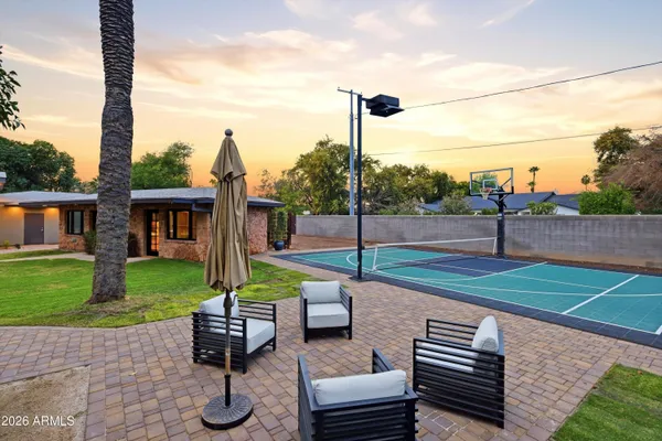 a view of a house with backyard porch and sitting area