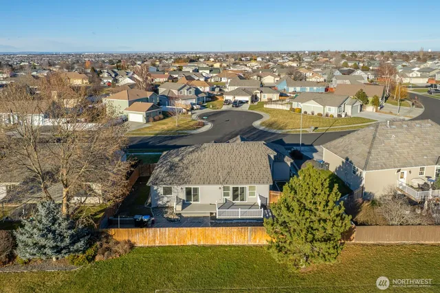 an aerial view of residential houses with outdoor space