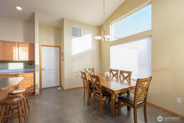 a dining room with furniture and window