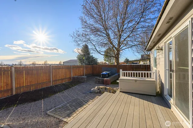 a view of balcony with wooden floor and outdoor seating