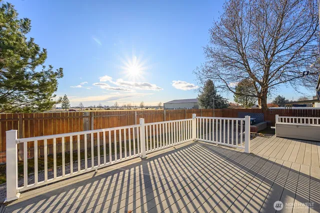 a view of deck with wooden floor and fence