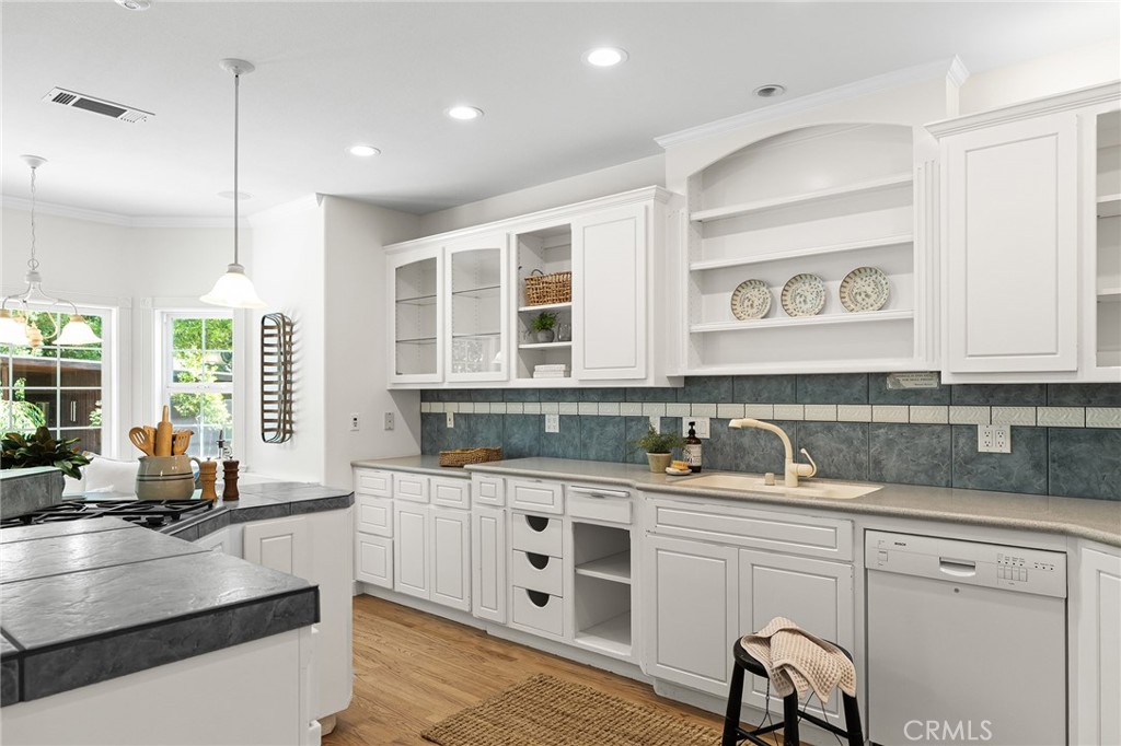 897 Filbert Avenue Chico, CA 95926 - Photo 16 of 66 a kitchen with a sink stove and cabinets