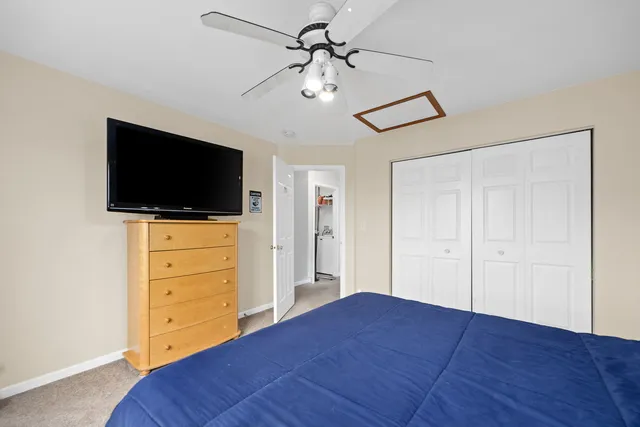 a view of a livingroom with an empty space & a flat screen tv