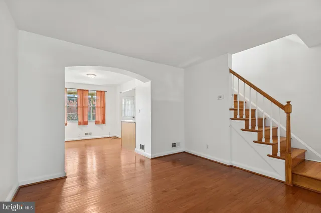 a view of an entryway with wooden floor