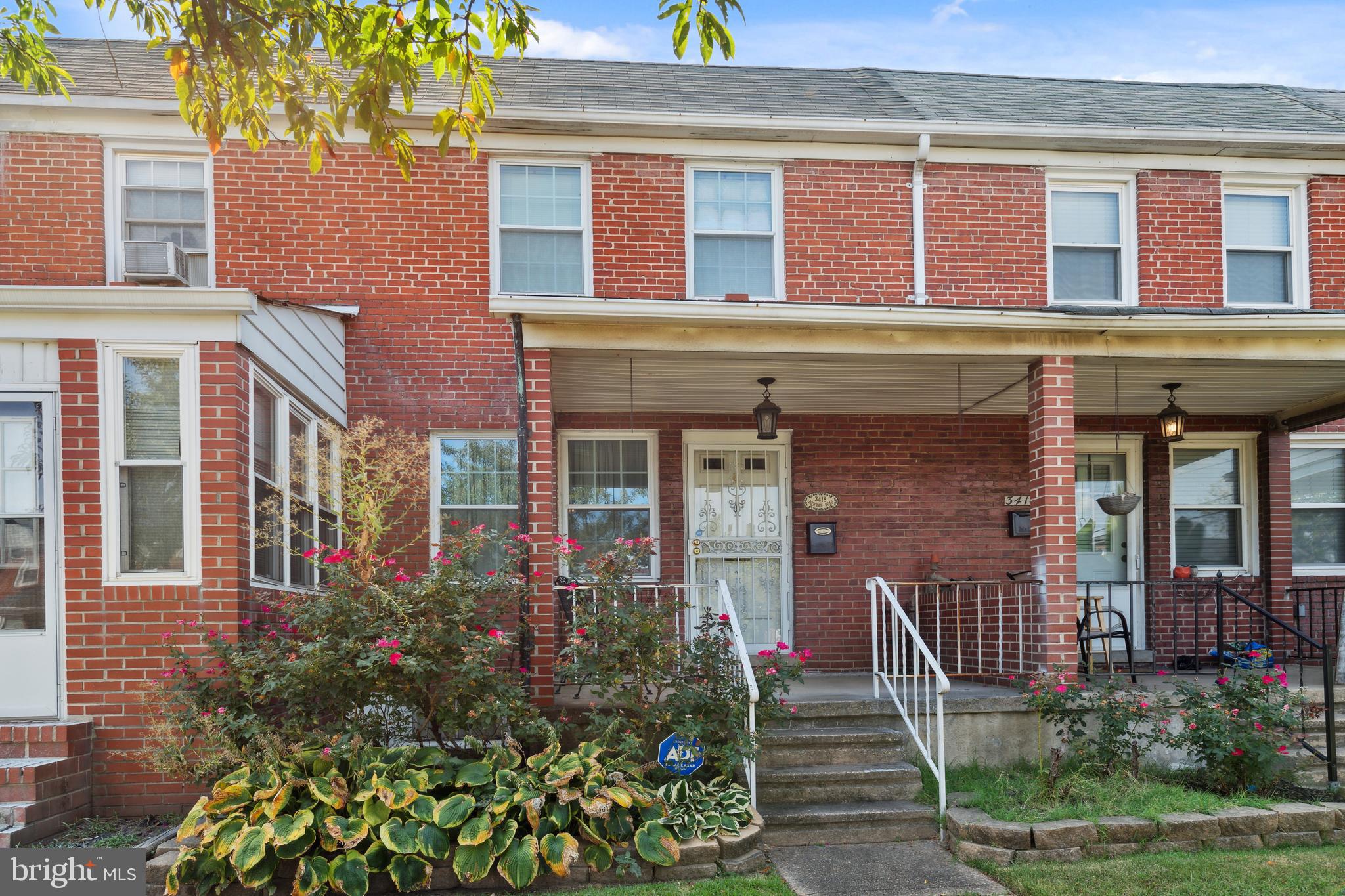 3418 Dunran Road Dundalk, MD 21222 - Photo 2 of 53 front view of a brick house with a large windows