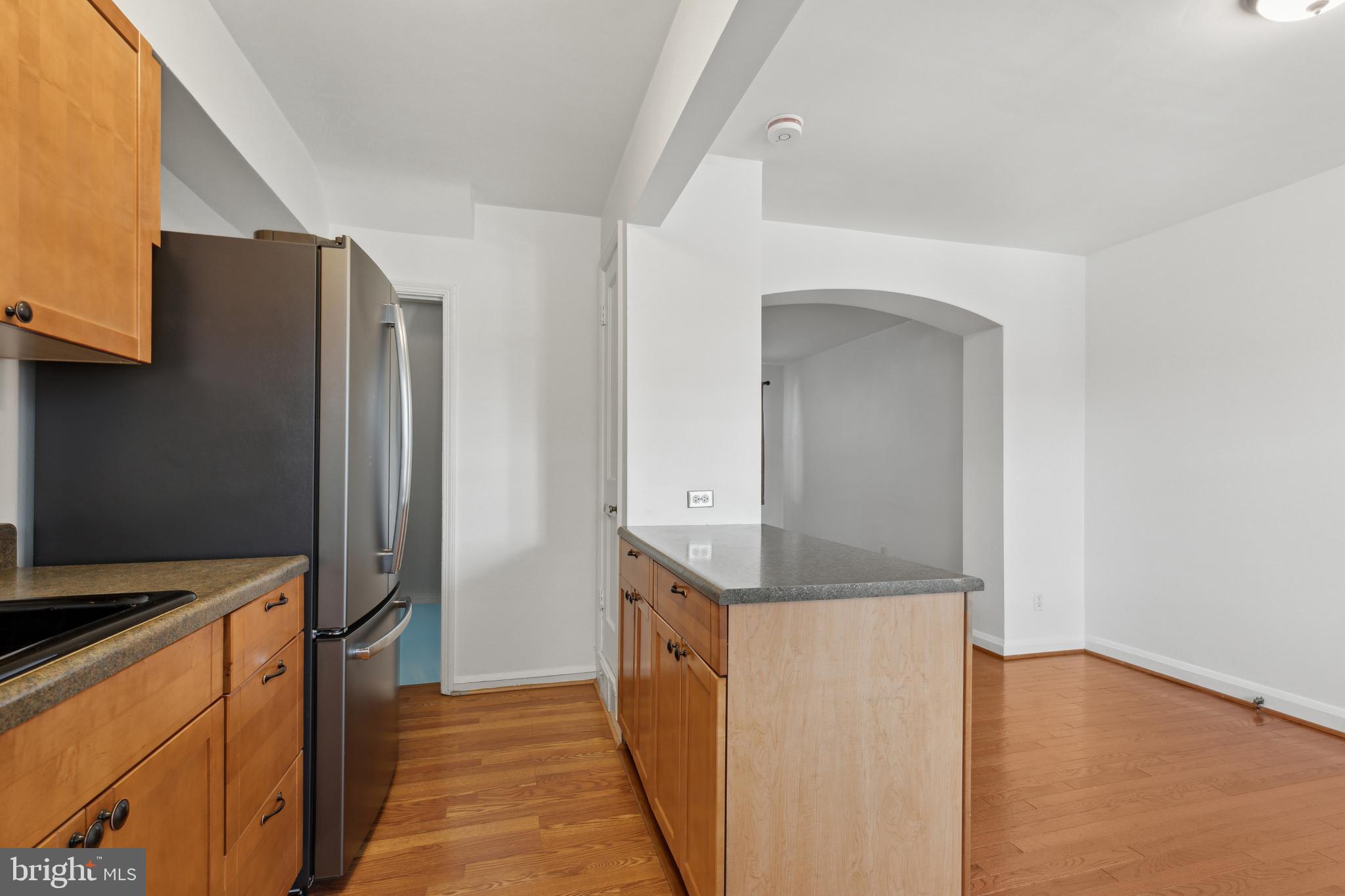 3418 Dunran Road Dundalk, MD 21222 - Photo 23 of 53 a kitchen with stainless steel appliances granite countertop a refrigerator and a stove