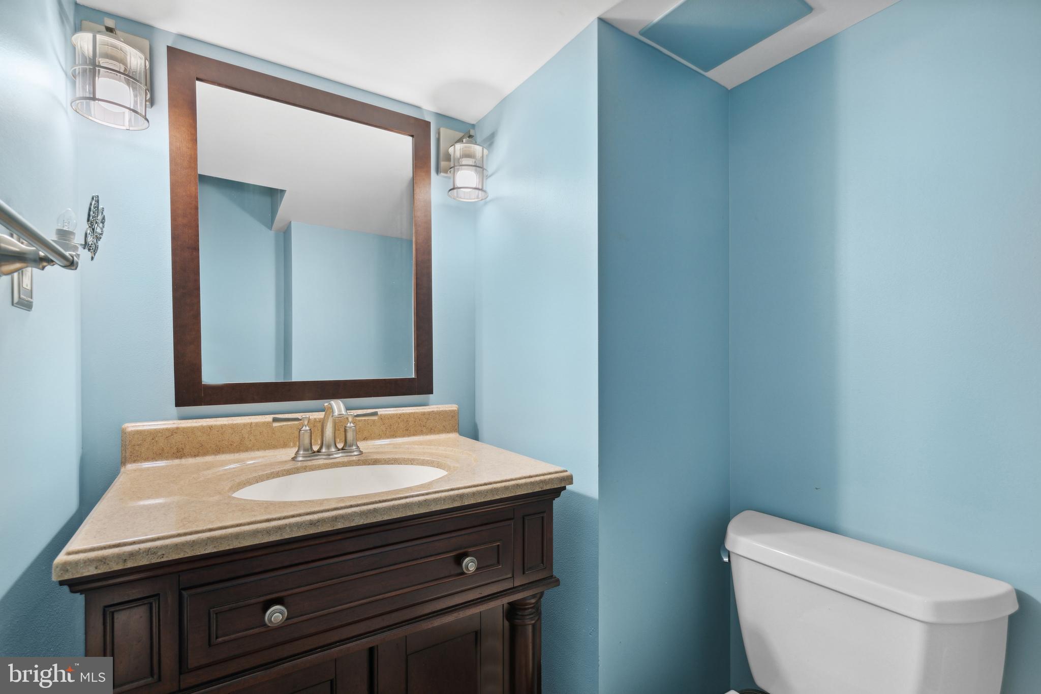 3418 Dunran Road Dundalk, MD 21222 - Photo 32 of 53 a bathroom with a sink a toilet and mirror