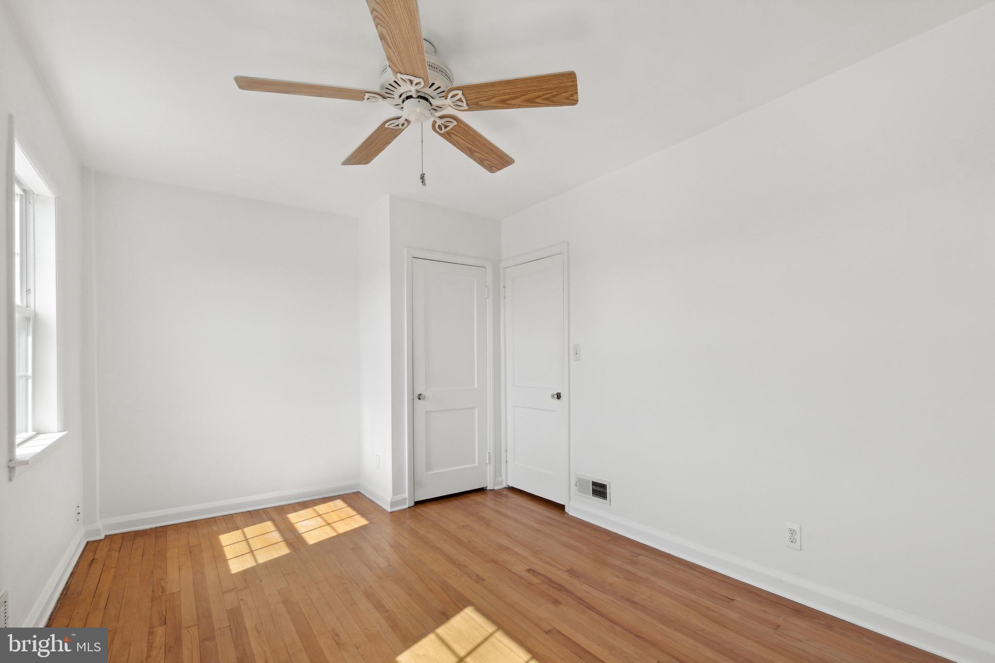 3418 Dunran Road Dundalk, MD 21222 - Photo 37 of 53 a view of room with window and wooden floor