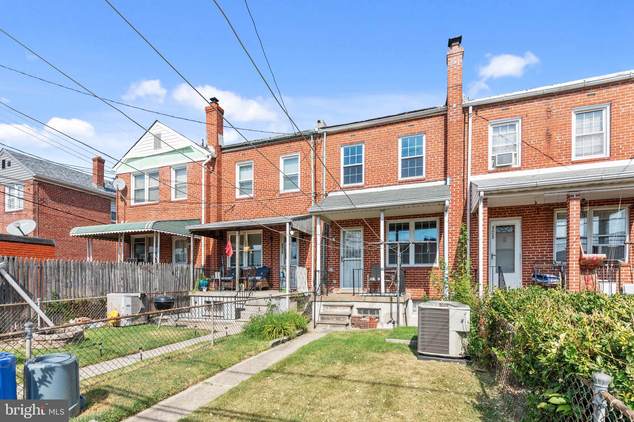 3418 Dunran Road Dundalk, MD 21222 - Photo 48 of 53 a front view of a building with sitting area