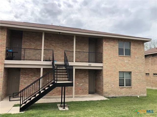 a front view of a house with garage