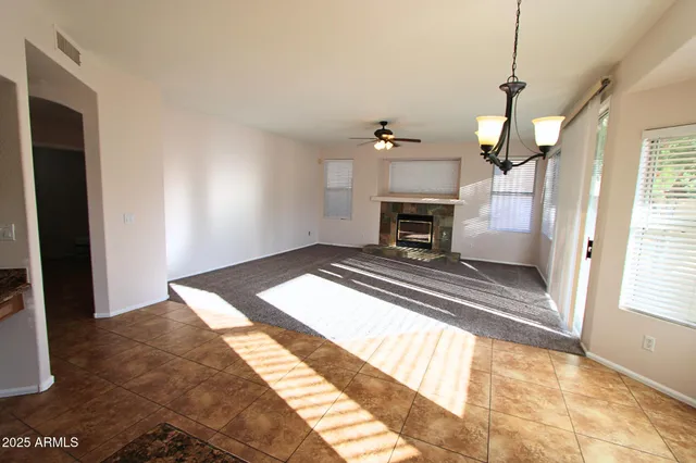 a bedroom with a bed and a fireplace