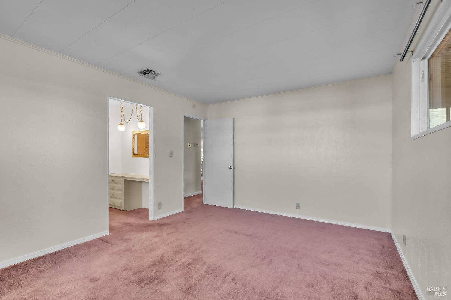 150 Silverado Trail, Unit 43 Napa, CA 94559 - Photo 12 of 29 an empty room with a bathroom and a window