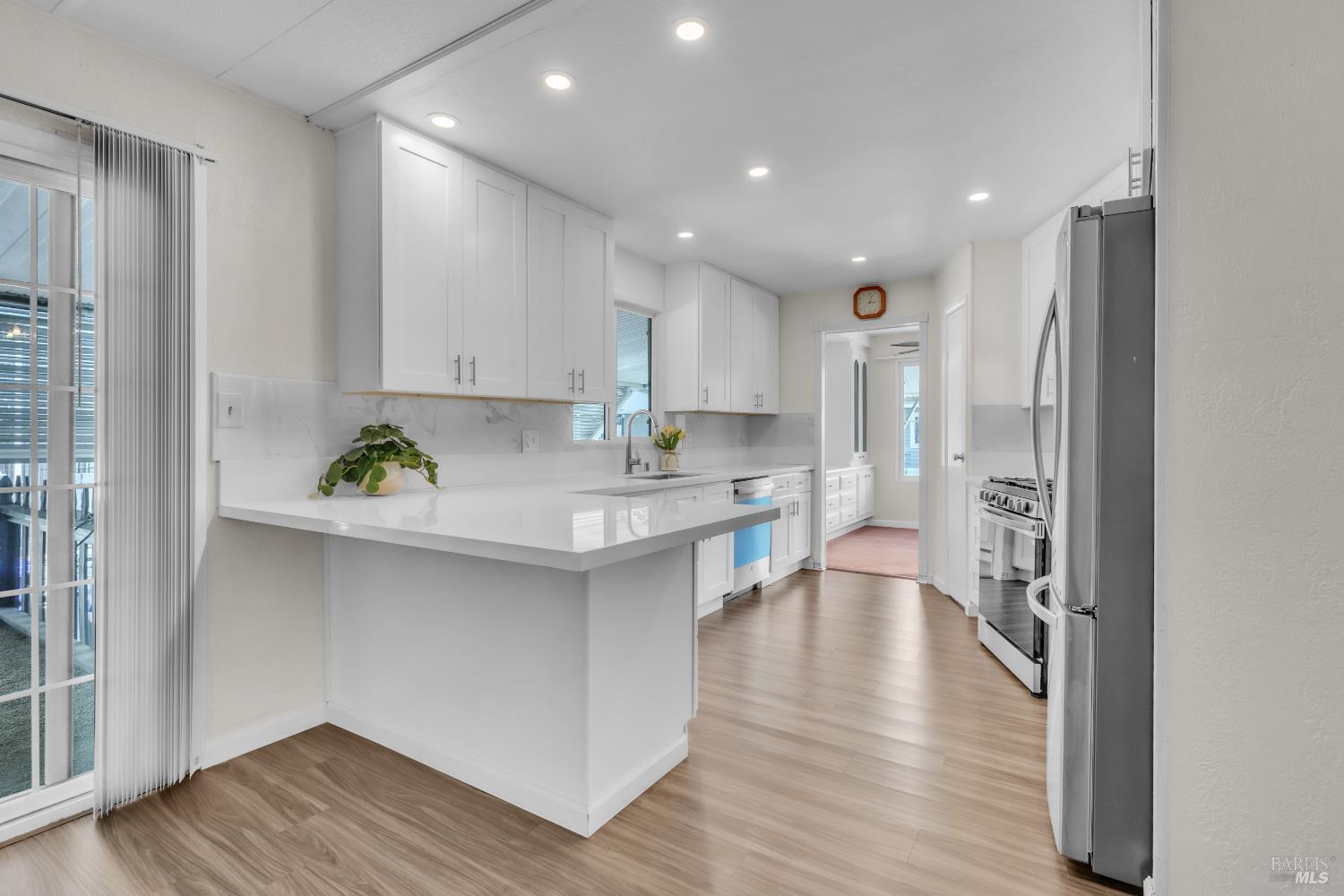 150 Silverado Trail, Unit 43 Napa, CA 94559 - Photo 4 of 29 a kitchen with stainless steel appliances granite countertop a refrigerator and a stove top oven