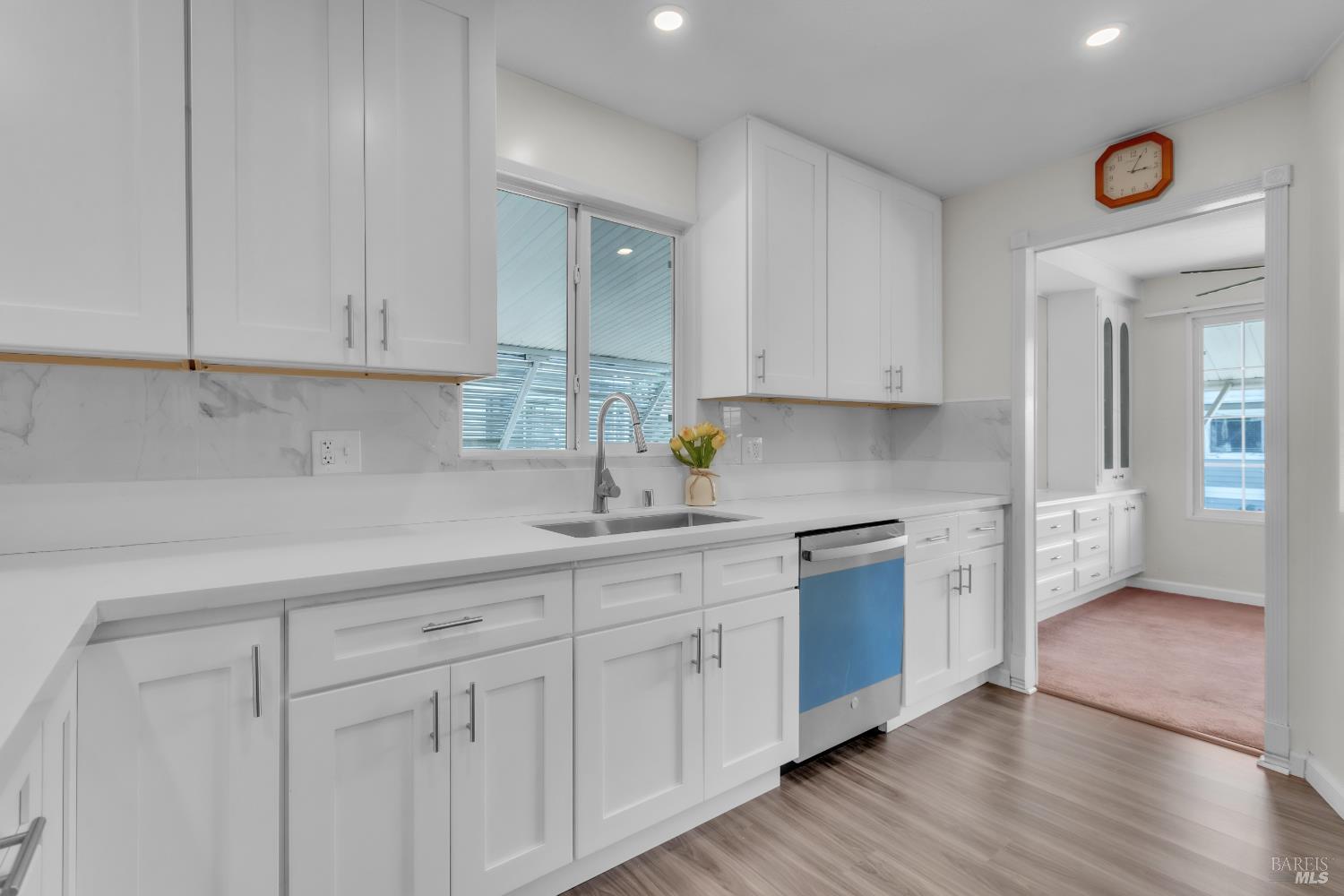 150 Silverado Trail, Unit 43 Napa, CA 94559 - Photo 5 of 29 a kitchen with white cabinets and white appliances