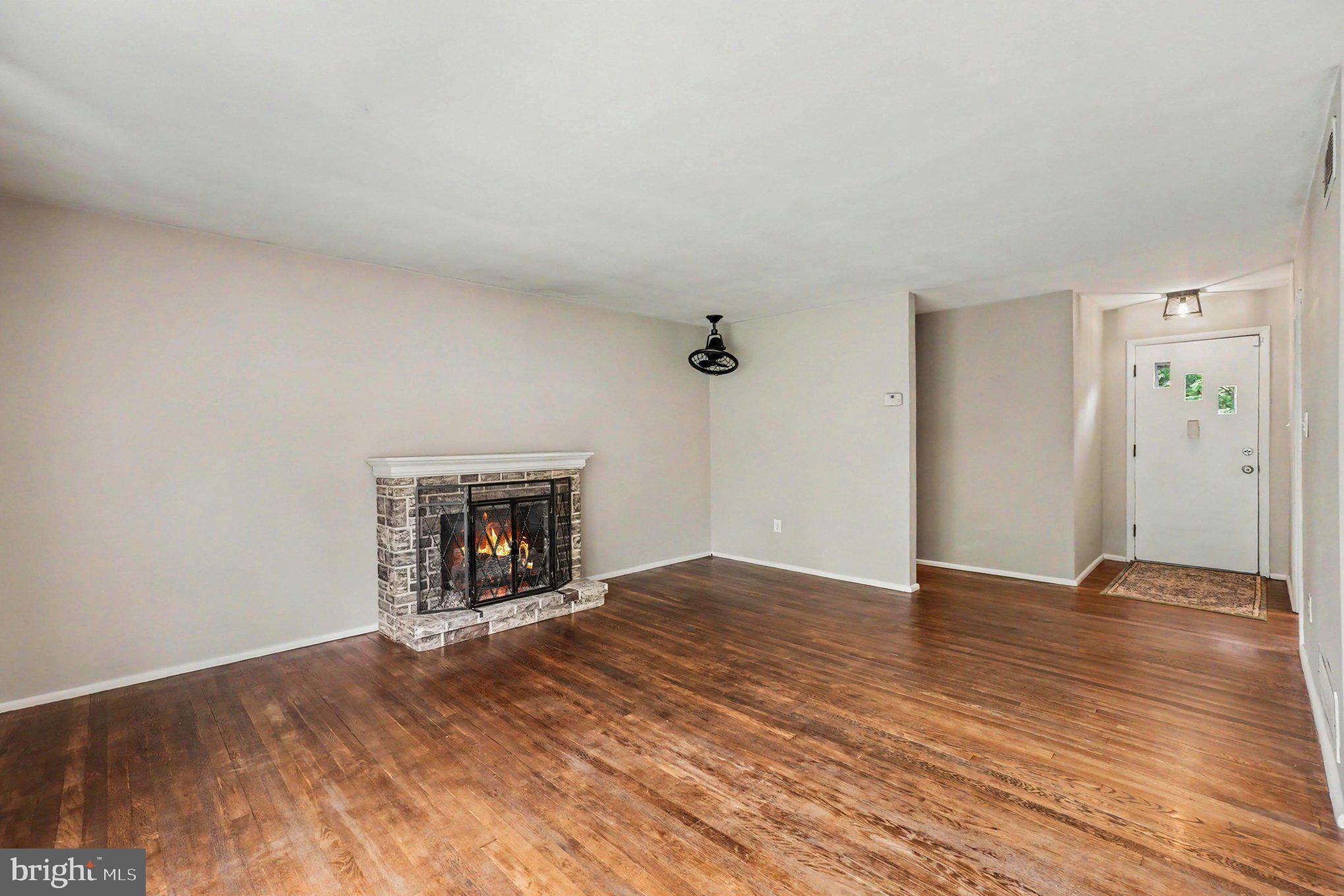 201 Mountain Road Fallston, MD 21047 - Photo 6 of 35 a view of an empty room with a fireplace
