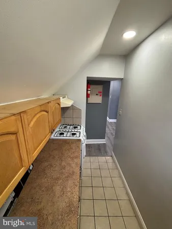a view of an empty room and fire place