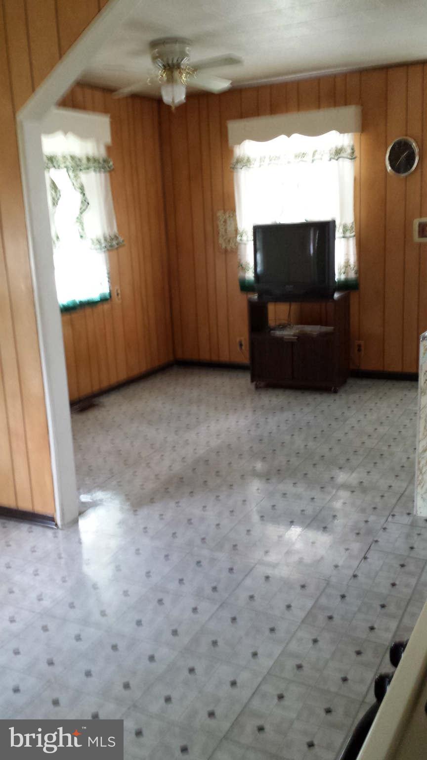 8229 Bullneck Road Baltimore, MD 21222 - Photo 6 of 10 a view of room with wooden floor and windows