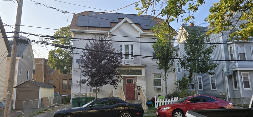 a front view of a houses with yard