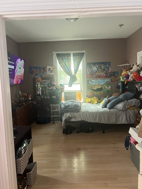 103 Warren Street Lynn, MA 01905 - Photo 11 of 24 a bedroom with a bed and a window