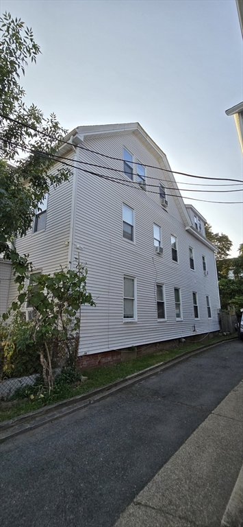 103 Warren Street Lynn, MA 01905 - Photo 15 of 24 a front view of a house with yard