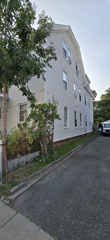 103 Warren Street Lynn, MA 01905 - Photo 16 of 24 a view of a house with a yard