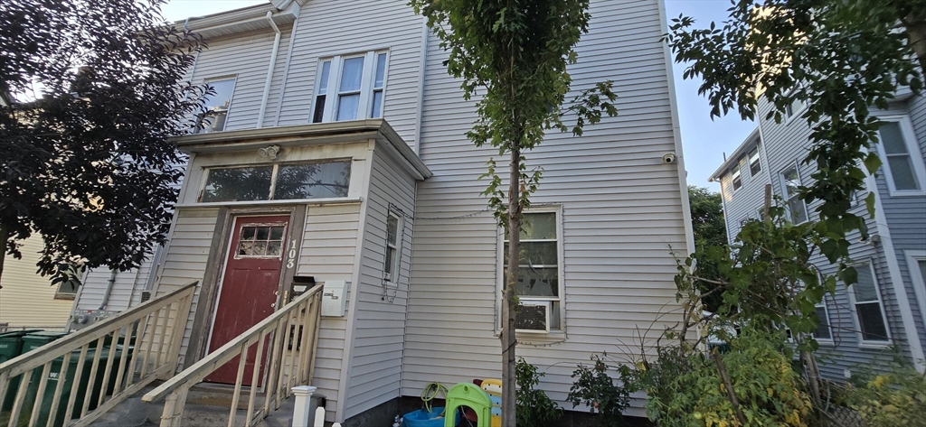 103 Warren Street Lynn, MA 01905 - Photo 18 of 24 a front view of a house with a tree