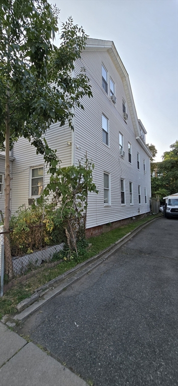 103 Warren Street Lynn, MA 01905 - Photo 22 of 24 a view of a house with a yard