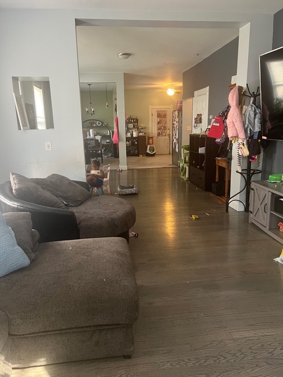 103 Warren Street Lynn, MA 01905 - Photo 5 of 24 a living room with furniture and a flat screen tv