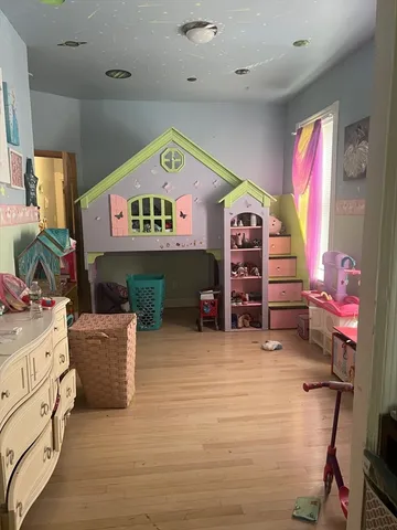 a view of a livingroom with furniture and a fireplace