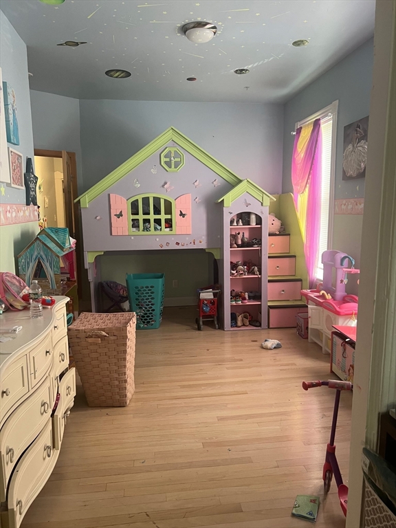 103 Warren Street Lynn, MA 01905 - Photo 9 of 24 a view of a livingroom with furniture and a fireplace