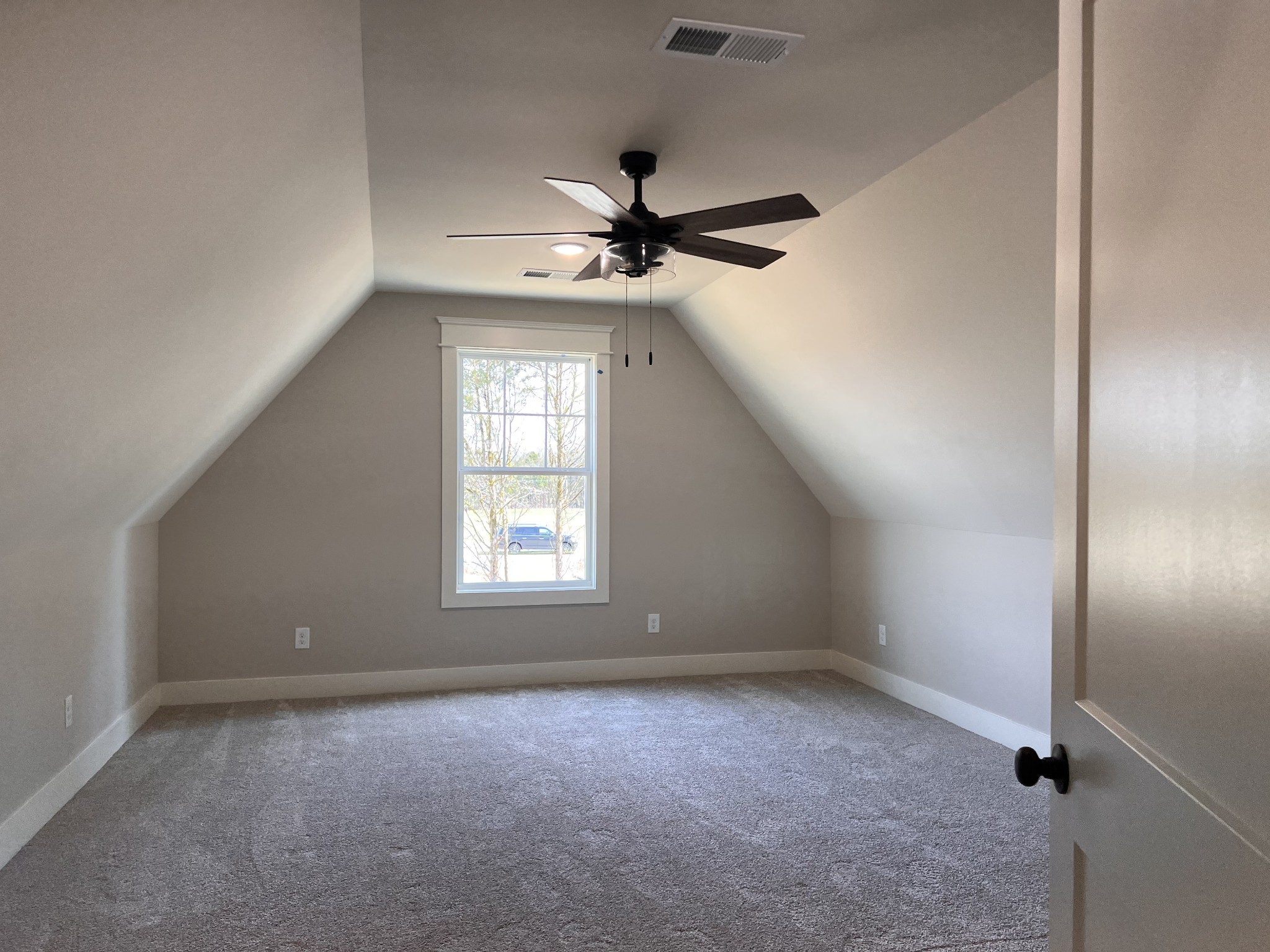 6730 Murfreesboro Road Lebanon, TN 37090 - Photo 12 of 12 an empty room with a window and a fan
