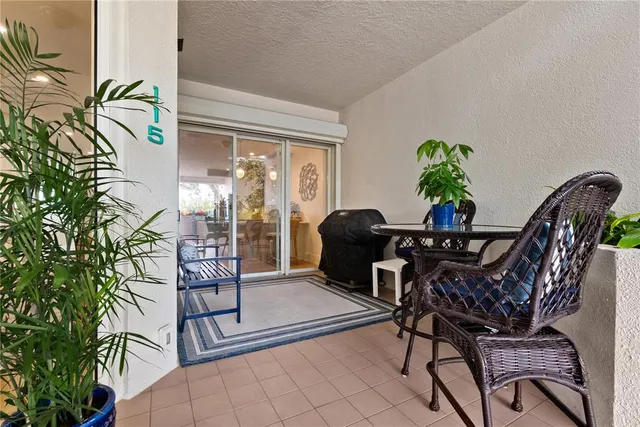 a view of a dining room with furniture and a potted plant