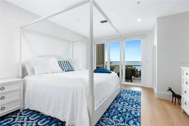 a bedroom with bed and a table