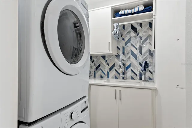 a close view of a utility room with dryer and washer