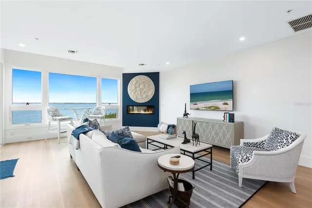 a living room with furniture and a clock