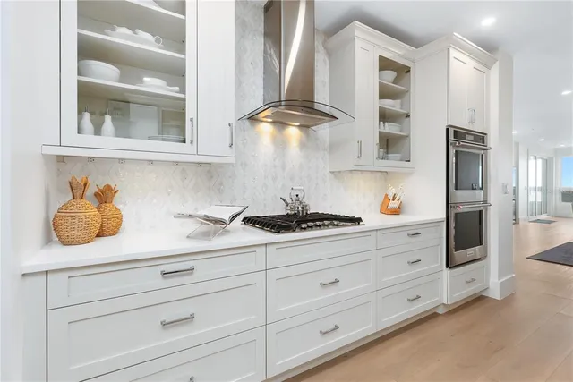 a kitchen with cabinets and appliances