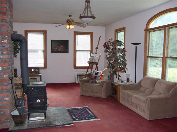 569 West Townsend Road Lunenburg, MA 01462 - Photo 6 of 18 a living room with furniture and a window