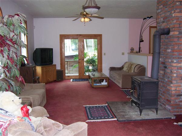 569 West Townsend Road Lunenburg, MA 01462 - Photo 7 of 18 a living room with furniture and a flat screen tv