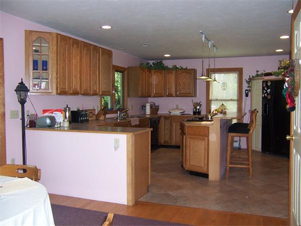 569 West Townsend Road Lunenburg, MA 01462 - Photo 8 of 18 a kitchen with sink cabinets and window