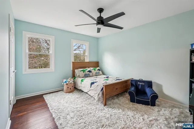 a bed room with a bed and a window