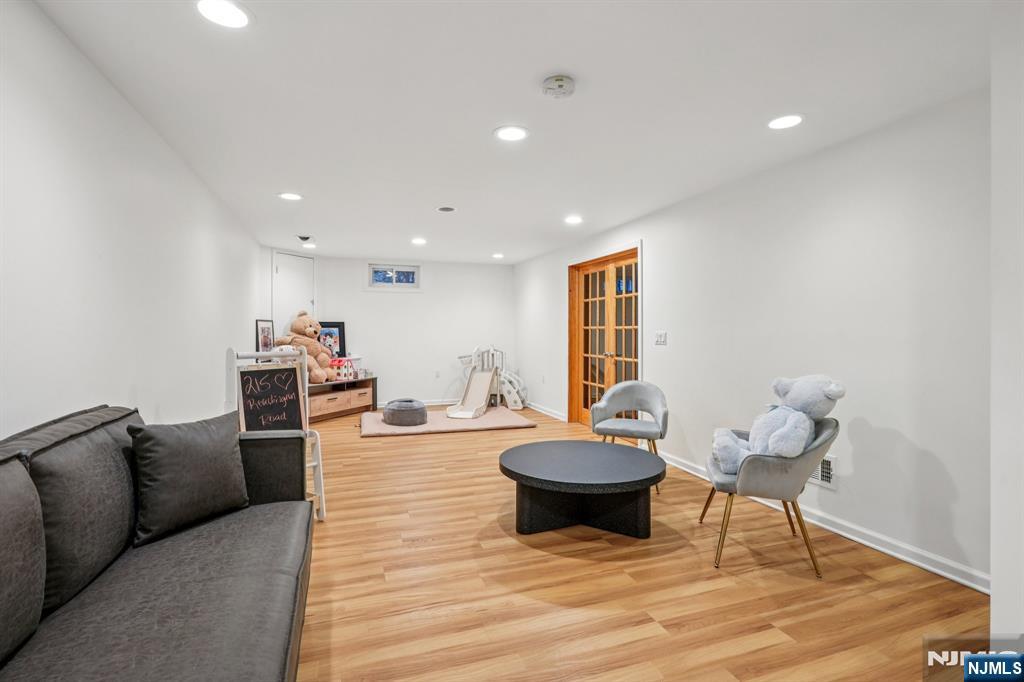 215 Readington Road Somerville, NJ 08876 - Photo 22 of 26 a living room with furniture and a wooden floor