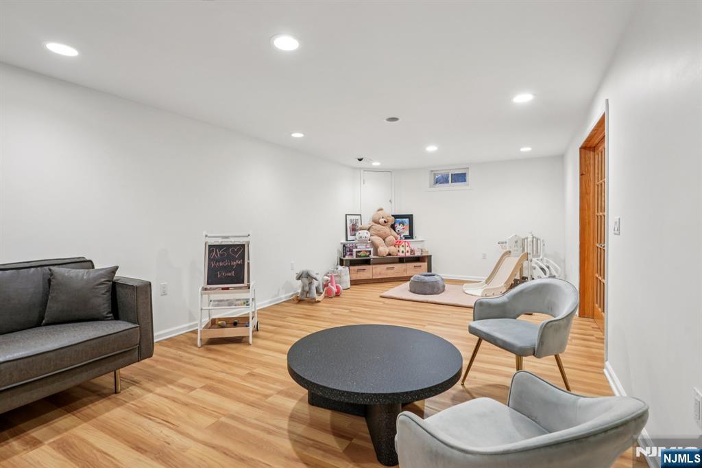 215 Readington Road Somerville, NJ 08876 - Photo 23 of 26 a living room with furniture and a wooden floor