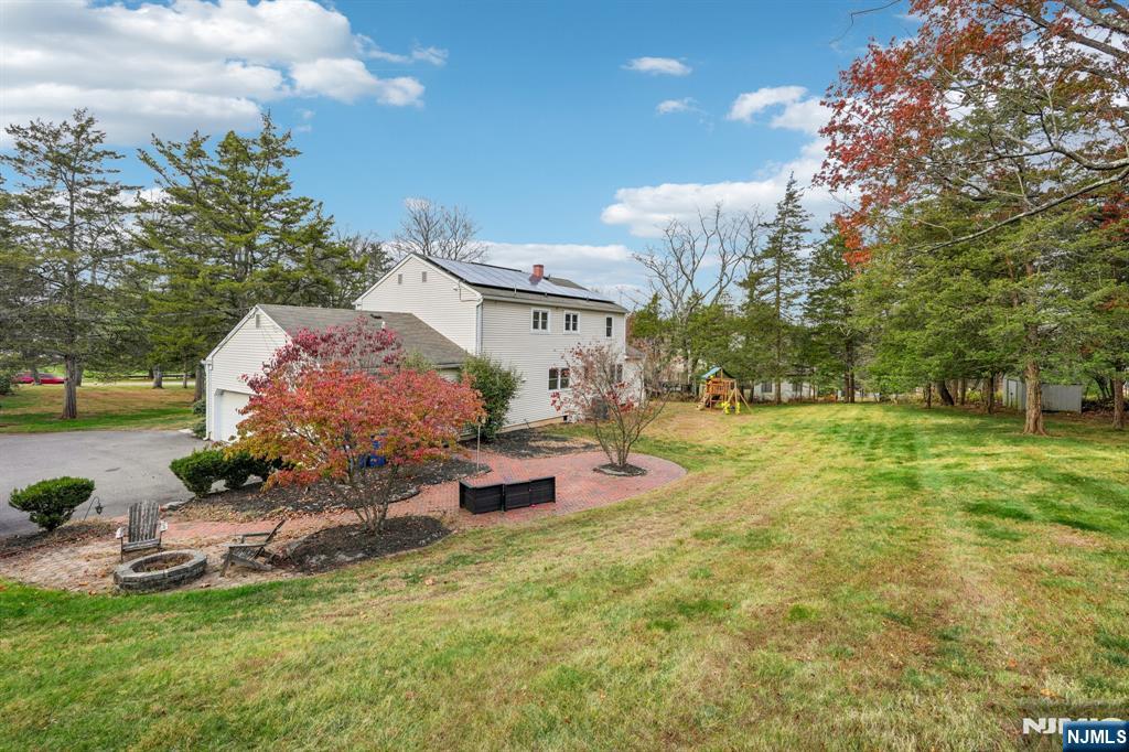 215 Readington Road Somerville, NJ 08876 - Photo 26 of 26 a front view of a house with garden and trees