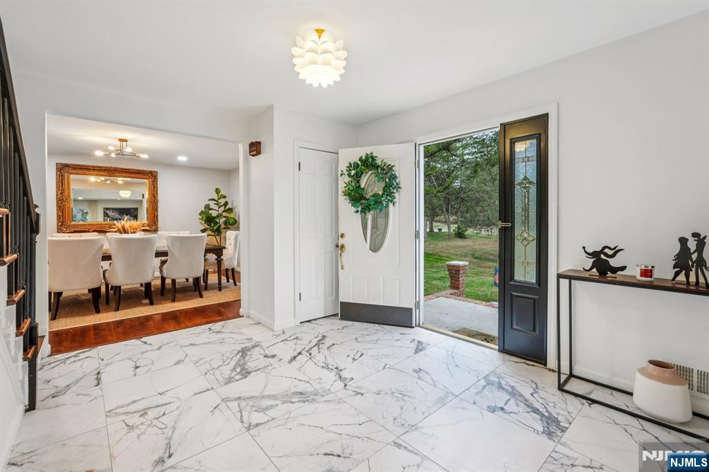 215 Readington Road Somerville, NJ 08876 - Photo 7 of 26 a view of a big room with windows and chandelier
