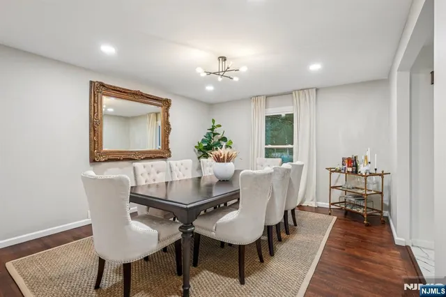 a dining room with furniture and wooden floor