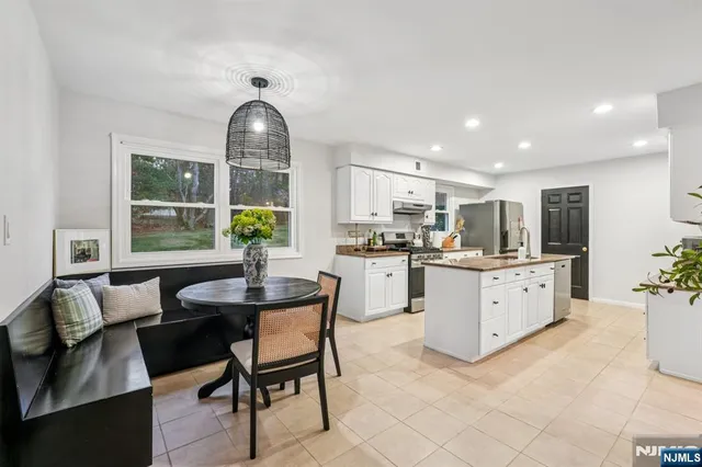 a view of a dining room with furniture window and outside view